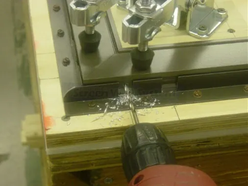 Step 4: Place the corner assembly into a holding jig, positioned so the corner is clean and tight. As shown, a fancy j