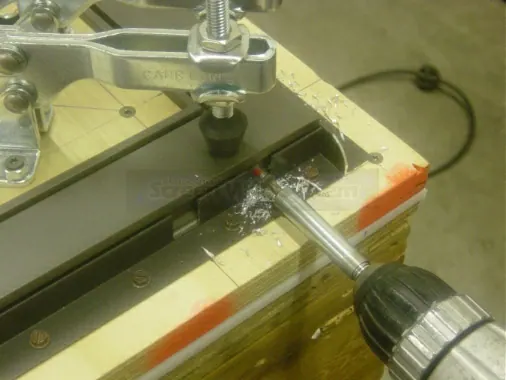 Step 7: Using a #26 drill bit, drill one hole at either of the two drilling positions on the opposing side. Watch care