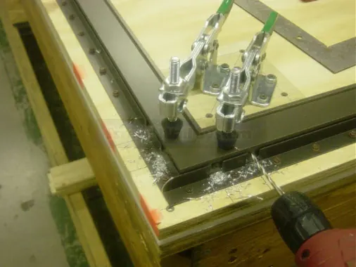 Step 8: Install one assembly screw in the drilled hole.