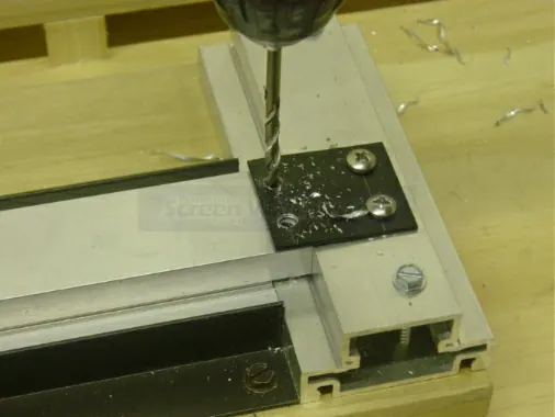 Step 2: Cover the exposed face of the divider extrusion with painters tape before notching, to help prevent scratching