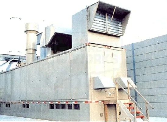 Screen panels fitted to rooftop exhaust ducting and louvres on an industrial building