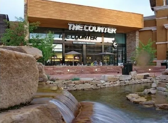 The Counter restaurant, its frontage screened above a rock water feature