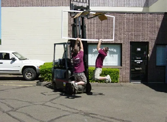 An oversized Screen Wall panel being manoeuvred by forklift