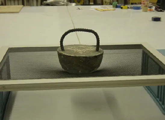 A cast weight bearing directly on a screen panel during the 44 lb screen load test