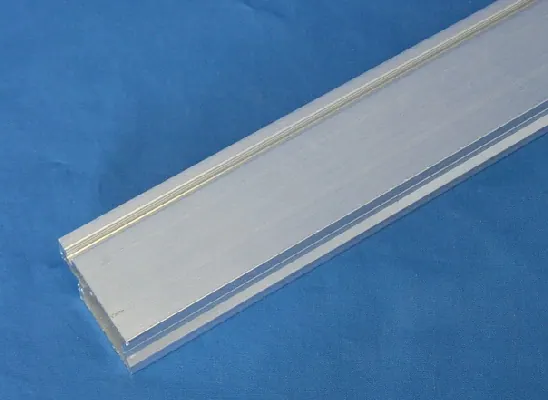 Close view of a master frame extrusion in a white commercial powder coat finish